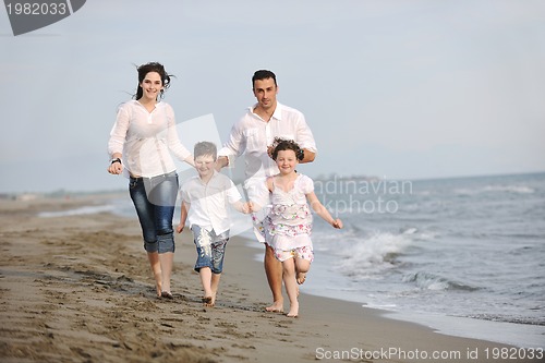 Image of happy young family have fun on beach