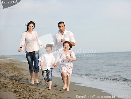 Image of happy young family have fun on beach