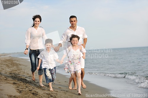 Image of happy young family have fun on beach