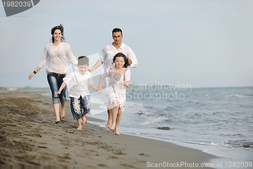 Image of happy young family have fun on beach