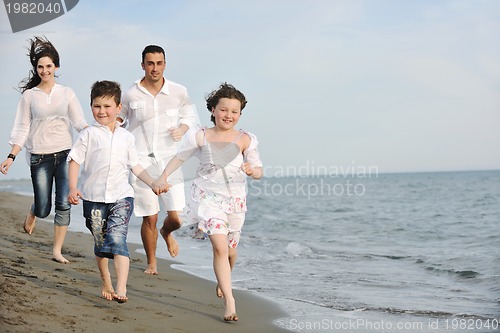 Image of happy young family have fun on beach