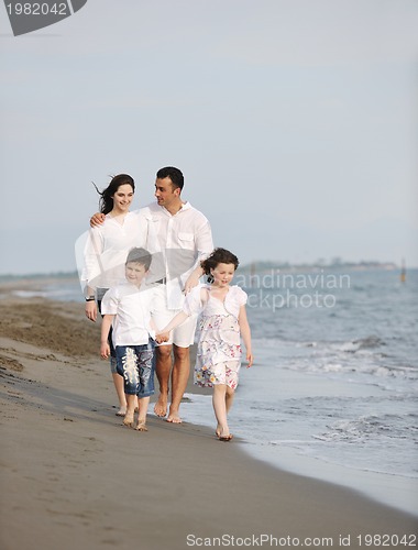 Image of happy young family have fun on beach