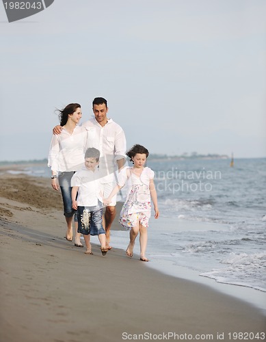 Image of happy young family have fun on beach