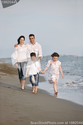 Image of happy young family have fun on beach