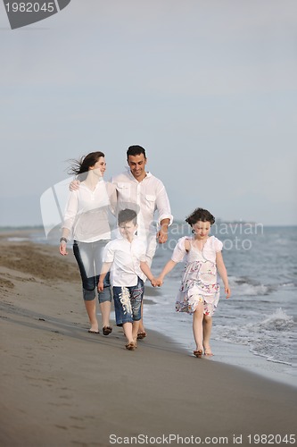 Image of happy young family have fun on beach