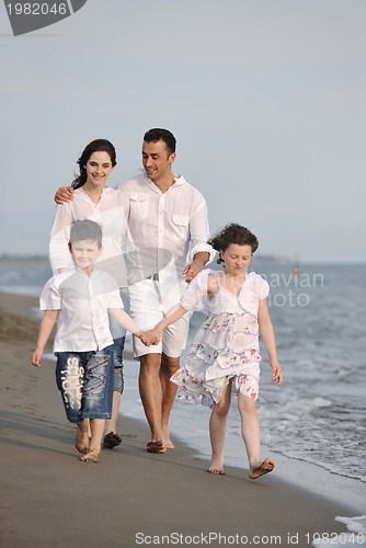 Image of happy young family have fun on beach