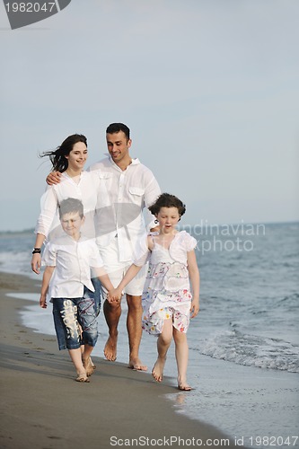 Image of happy young family have fun on beach