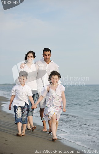 Image of happy young family have fun on beach