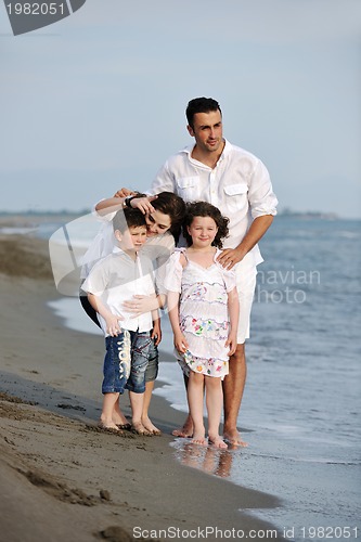 Image of happy young family have fun on beach