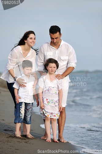 Image of happy young family have fun on beach
