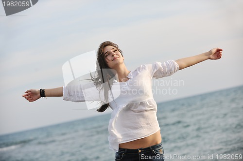 Image of young woman enjoy on beach