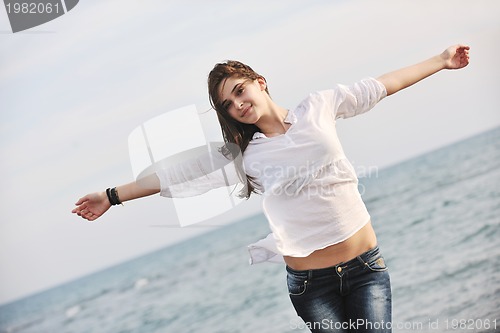 Image of young woman enjoy on beach