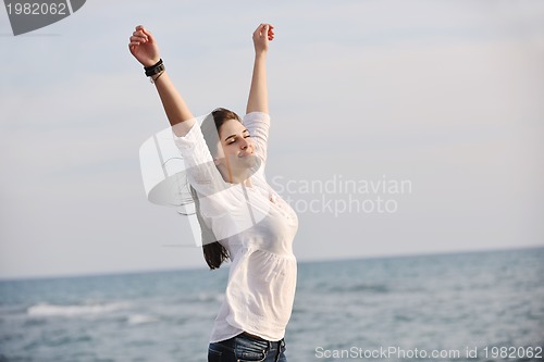 Image of young woman enjoy on beach