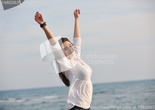 Image of young woman enjoy on beach