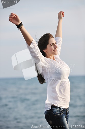 Image of young woman enjoy on beach