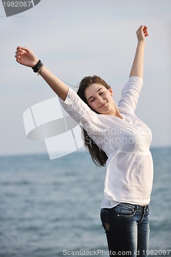 Image of young woman enjoy on beach