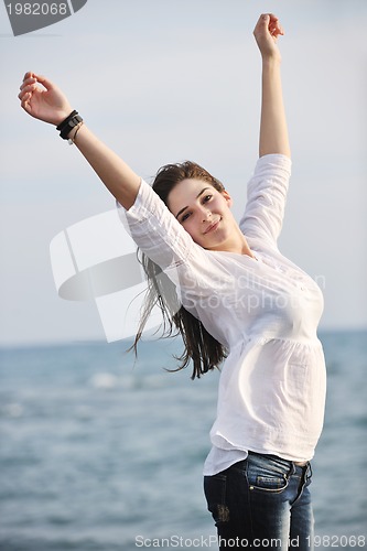 Image of young woman enjoy on beach