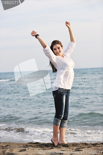 Image of young woman enjoy on beach