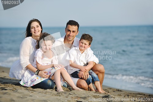 Image of happy young family have fun on beach