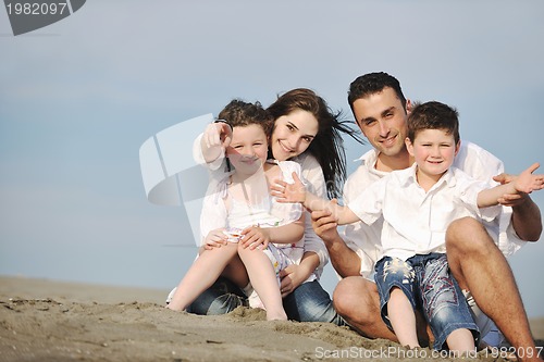 Image of happy young family have fun on beach