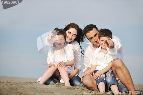 Image of happy young family have fun on beach
