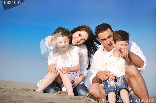 Image of happy young family have fun on beach