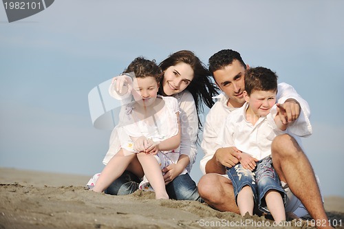 Image of happy young family have fun on beach