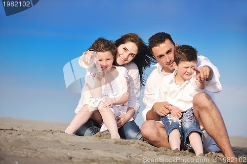 Image of happy young family have fun on beach