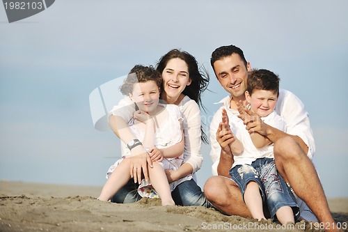 Image of happy young family have fun on beach