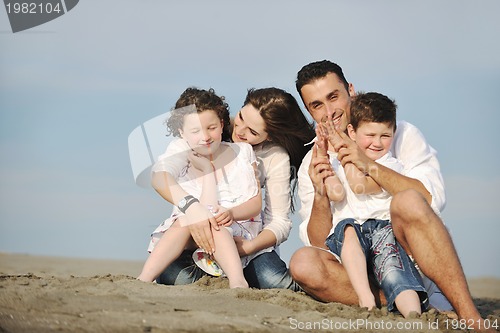 Image of happy young family have fun on beach