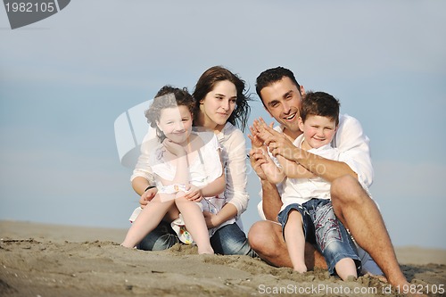 Image of happy young family have fun on beach