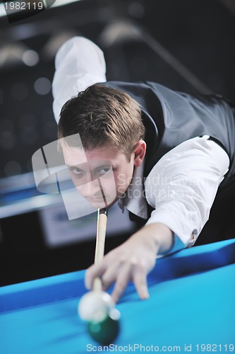 Image of young man play pro billiard game 