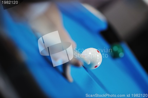 Image of young man play pro billiard game 