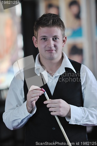 Image of young man play pro billiard game 