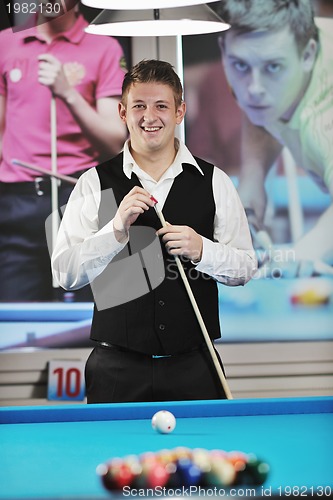 Image of young man play pro billiard game 