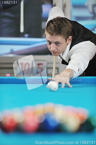 Image of young man play pro billiard game 