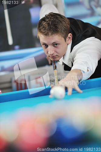 Image of young man play pro billiard game 