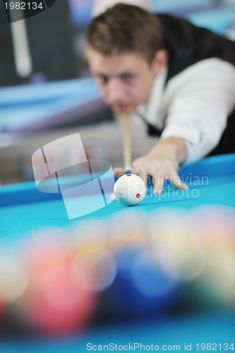 Image of young man play pro billiard game 