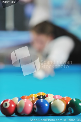 Image of young man play pro billiard game 