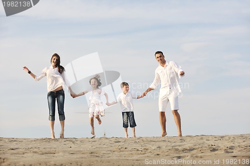 Image of happy young family have fun on beach