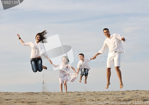 Image of happy young family have fun on beach