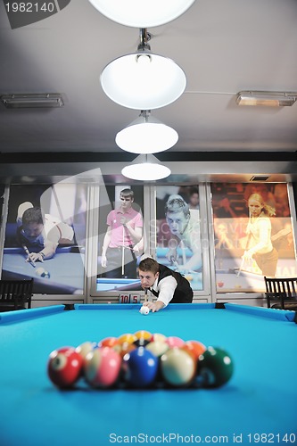 Image of young man play pro billiard game 