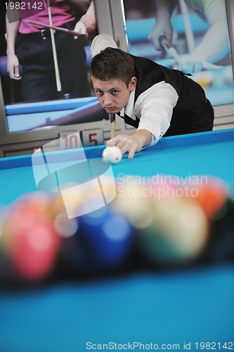 Image of young man play pro billiard game 