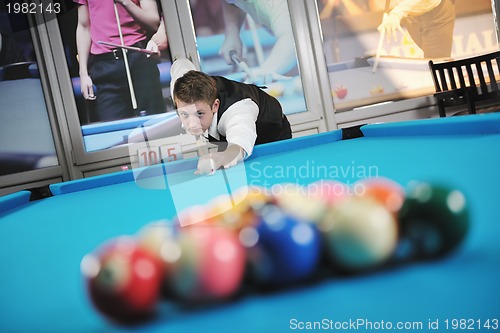 Image of young man play pro billiard game 