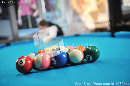 Image of young man play pro billiard game 