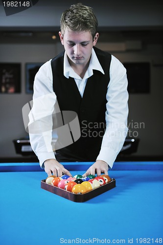 Image of young man play pro billiard game 