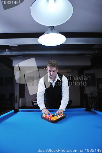 Image of young man play pro billiard game 