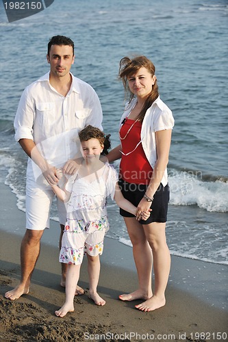 Image of happy young family have fun on beach