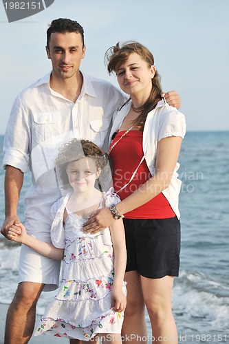 Image of happy young family have fun on beach