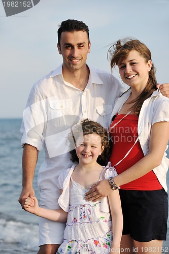 Image of happy young family have fun on beach